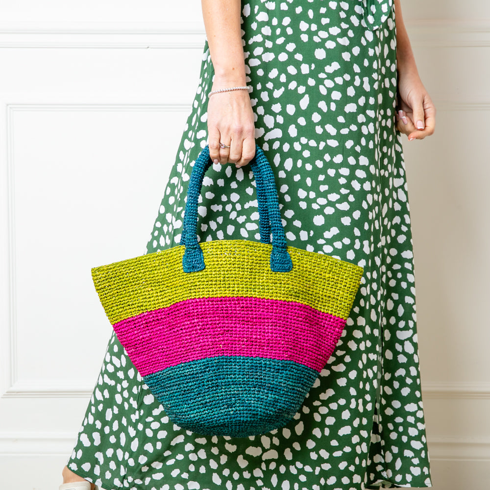 The Raffia Bucket Bag which can be rolled or folded for travelling making it the perfect bag for your summer beach holiday